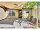 Private patio with shade sail, air conditioning unit and direct access to the home at 8871 E Amherst Dr # B, Denver, CO 80231