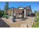 Relaxing backyard patio with pergola, seating area, and fire pit at 7144 Galaxy Ct, Castle Rock, CO 80108