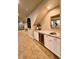 Basement wet bar with wine cooler and cabinets at 7144 Galaxy Ct, Castle Rock, CO 80108