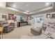 Finished basement Gathering room with sectional sofa and TV at 7144 Galaxy Ct, Castle Rock, CO 80108