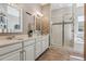 Elegant bathroom with double vanity and walk-in shower at 7144 Galaxy Ct, Castle Rock, CO 80108