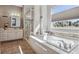 Bathroom featuring a soaking tub and walk-in shower at 7144 Galaxy Ct, Castle Rock, CO 80108