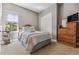 Bright bedroom with dresser and large closet at 7144 Galaxy Ct, Castle Rock, CO 80108