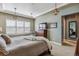 Spacious bedroom with large windows and comfortable sitting area at 7144 Galaxy Ct, Castle Rock, CO 80108