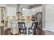 Modern kitchen with white cabinets and granite countertops at 7144 Galaxy Ct, Castle Rock, CO 80108