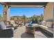 Relaxing patio with fire pit, comfortable seating, and outdoor dining area at 7144 Galaxy Ct, Castle Rock, CO 80108