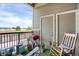 Inviting balcony space with patio furniture, grill, and outdoor decor overlooking the neighborhood at 9227 Rolling Way # 201, Parker, CO 80134