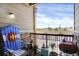 Charming balcony with comfortable seating and a grill, perfect for relaxing and enjoying the view at 9227 Rolling Way # 201, Parker, CO 80134