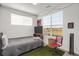 Cozy bedroom with desk, chair, and view from the window at 9227 Rolling Way # 201, Parker, CO 80134