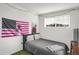 A cozy bedroom is decorated with a flag and a movie poster, adding a personal touch at 9227 Rolling Way # 201, Parker, CO 80134