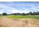 Expansive community green space with lush lawns and multiple dwelling buildings in the background at 9227 Rolling Way # 201, Parker, CO 80134