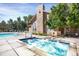 Relaxing community hot tub next to the pool, surrounded by well-manicured landscaping and comfortable seating at 9227 Rolling Way # 201, Parker, CO 80134