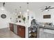 Open-concept kitchen featuring a large island, stainless steel appliances, and ample cabinet space at 9227 Rolling Way # 201, Parker, CO 80134