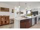Open concept kitchen with an island that offers generous counter space and storage cabinets at 9227 Rolling Way # 201, Parker, CO 80134