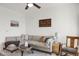 Bright living room with cozy sectional, modern ceiling fan and a warm decorative feel at 9227 Rolling Way # 201, Parker, CO 80134