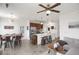Well-lit living space with a large island, stainless steel appliances, dining, and living area at 9227 Rolling Way # 201, Parker, CO 80134