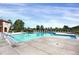 Beautiful community pool with clear blue water, ample seating, and a well-maintained deck area at 9227 Rolling Way # 201, Parker, CO 80134