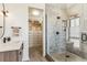 Bright bathroom showcases walk-in shower and closet with built-in shelving and drawers at 4651 Alcott St, Denver, CO 80211