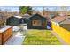 Aerial view of a fenced backyard with a detached garage and new lawn at 469 S Perry St, Denver, CO 80219