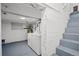 Basement utility area with a washer, dryer, and concrete walls at 469 S Perry St, Denver, CO 80219