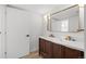 A bathroom with a double vanity and modern fixtures at 469 S Perry St, Denver, CO 80219