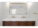 Bathroom featuring double vanity, modern lighting, and updated fixtures at 469 S Perry St, Denver, CO 80219