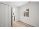 Bedroom featuring light filled window and closet with an open doorway at 469 S Perry St, Denver, CO 80219