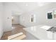 View of the kitchen and entry, featuring bright white counters and a large window at 469 S Perry St, Denver, CO 80219