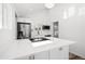 Stylish kitchen featuring stainless steel appliances and a large island at 469 S Perry St, Denver, CO 80219