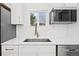 Updated kitchen showcases stainless appliances, modern sink, and bright countertops at 469 S Perry St, Denver, CO 80219