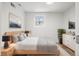 Bright main bedroom features a neutral color palette and ample natural light at 469 S Perry St, Denver, CO 80219