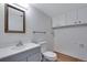 Well-lit bathroom with large mirror, white vanity, and updated fixtures at 10390 Tumbleweed Dr # 7, Thornton, CO 80229