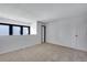 Bright bedroom with neutral colored walls and carpet at 10390 Tumbleweed Dr # 7, Thornton, CO 80229