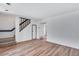 View of the living room, stairs, and hardwood floors at 10390 Tumbleweed Dr # 7, Thornton, CO 80229