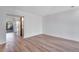 Spacious living room featuring light wood floors and bright white walls at 10390 Tumbleweed Dr # 7, Thornton, CO 80229