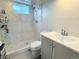 Updated bathroom featuring a glass door shower and vanity with a sleek countertop at 2533 E 90Th Pl, Thornton, CO 80229