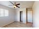 Bedroom with wood-look floors, closet and a window letting in natural light at 2533 E 90Th Pl, Thornton, CO 80229