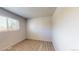 Bedroom with light-colored walls, a large window, and wood-look flooring at 2533 E 90Th Pl, Thornton, CO 80229