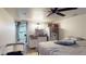 Bedroom featuring a kitchenette, ceiling fan and direct access to the laundry area at 2533 E 90Th Pl, Thornton, CO 80229