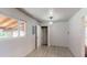 Clean and empty room with light wood floors, neutral walls, and a single window at 2533 E 90Th Pl, Thornton, CO 80229
