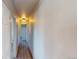 Hallway with wood flooring and recessed lighting that leads to multiple rooms at 2533 E 90Th Pl, Thornton, CO 80229