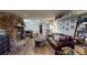 Comfortable living room with wood-look floors, stone fireplace, and neutral paint colors at 2533 E 90Th Pl, Thornton, CO 80229