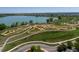 Aerial view of a recreational area with bike paths, a lake, and walking trails in a suburban setting at 2488 Lake Vista Dr, Broomfield, CO 80023