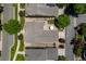 Aerial view of a backyard with a patio area, including an outdoor dining set, lounge chairs, and an umbrella at 2488 Lake Vista Dr, Broomfield, CO 80023