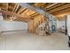 Unfinished basement with exposed wooden beams, concrete floors and mechanical systems at 2488 Lake Vista Dr, Broomfield, CO 80023