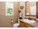 Stylish powder room featuring a unique mirror, vessel sink, and textured wallpaper at 2488 Lake Vista Dr, Broomfield, CO 80023