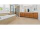 Bright bathroom features a soaking tub and walk-in shower at 2488 Lake Vista Dr, Broomfield, CO 80023