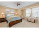 Cozy bedroom is illuminated by natural light and features a ceiling fan at 2488 Lake Vista Dr, Broomfield, CO 80023