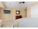 This bright bedroom has neutral walls and carpeting and a ceiling fan at 2488 Lake Vista Dr, Broomfield, CO 80023