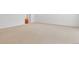 Large carpeted bedroom with a view of an adjacent bathroom at 2488 Lake Vista Dr, Broomfield, CO 80023